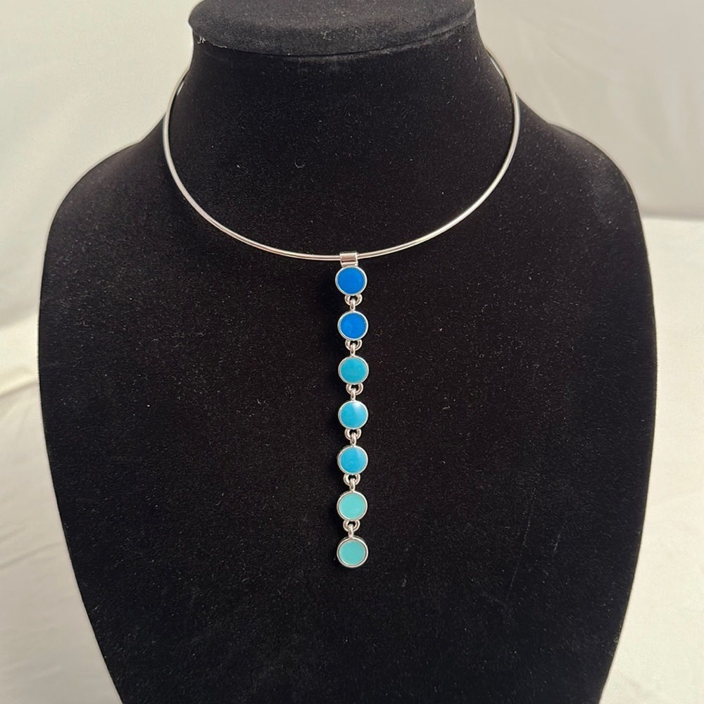 Express nickel and shades of blue enamel dangle necklace